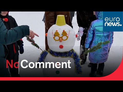 Russians enjoy winter weather at snowman festival