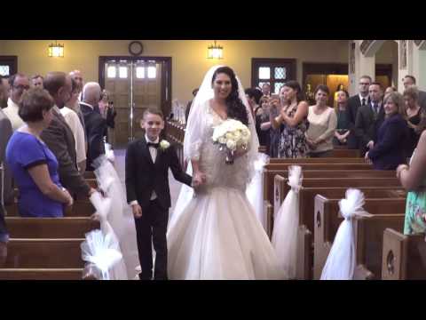 BRIDES YOUNG SON WALKS HER UP THE AISLE