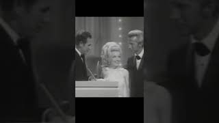 In 1968, Dolly Parton and Porter Wagoner accepted their first CMA Award together.