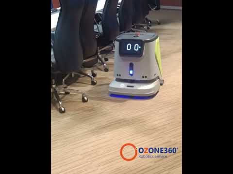 หุ่นยนต์ทำความสะอาดบนพื้นพรมในตึกสำนักงาน หุ่นยนต์ทำความสะอาดบนพื้นพรมในตึกสำนักงาน