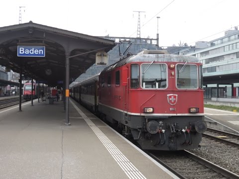 Switzerland: SBB Re 4/4 II electric hauled passenger train leaving Baden towards Basel