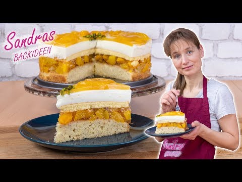 Pfirsichtorte mit Joghurt Quark Mandelboden und Biskuit. So lecker, davon bekommst Du nie genug.