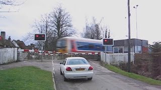 UK: Trains passing Causeway Level Crossing at Steventon (near Didcot), Oxfordshire in 2003.