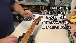 Adjust your neck relief... make your guitar more playable (it will also lower the string action!)