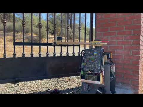 Elite Garage Door & Gate Repair team performing on-site gate opener installation in El Dorado County