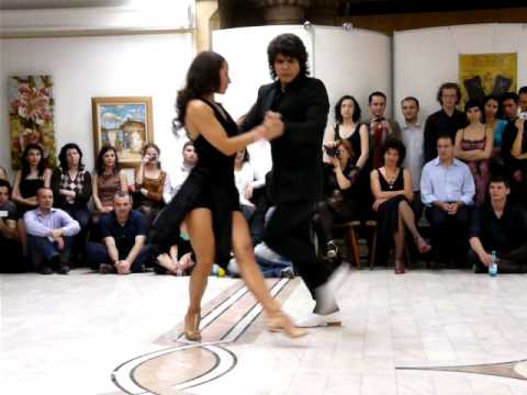  Adrian Veredice  and  Alejandra Hobert  are  dancing  to  a  tango  at  Bucharest Tango Encuentro Festival  in  2009