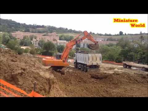 FIAT-HITACHI EX215 loading ASTRA truck with CANTONI tipper