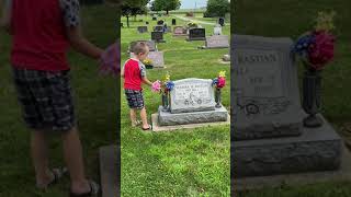 Putting flowers on grandmas grave