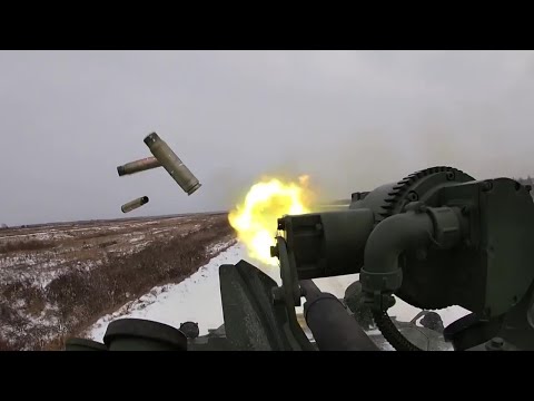 Russian armored personnel carrier BTR-82 is firing