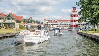 preview picture of video 'Hafendorf Rheinsberg: Hausboot fahren in Brandenburg'