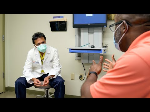 How do specialists at UF Health Jacksonville care for patients with urological cancer?