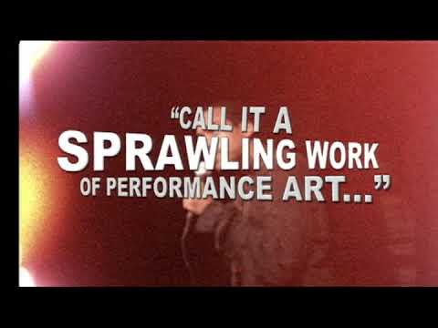 Onstage sequence: Youth mid-aria as the Narrator grins; the band rides a tight backbeat