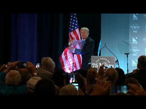 Trump Hugs Flag After Immigration Speech