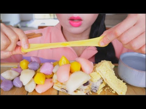 Traditional Korean tteok shop displaying rows of freshly made rice cakes in various colors and shapes