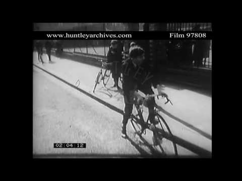 Boy Cycles Home From School, 1960's.  Archive film 97808