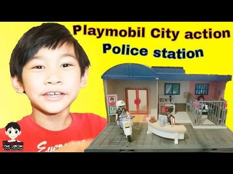 Kingston's building the Playmobil City action Police station set and pretend play