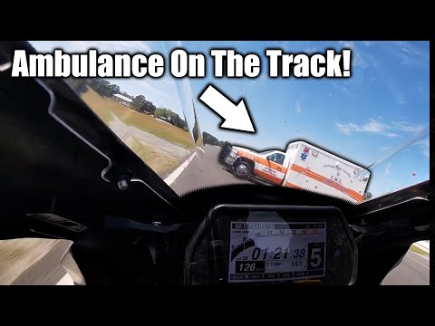Ambulance Crosses LIVE Track During Motorcycle Race