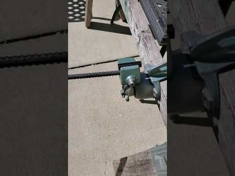 One Man method of fire curing and wiping Bamboo poles...