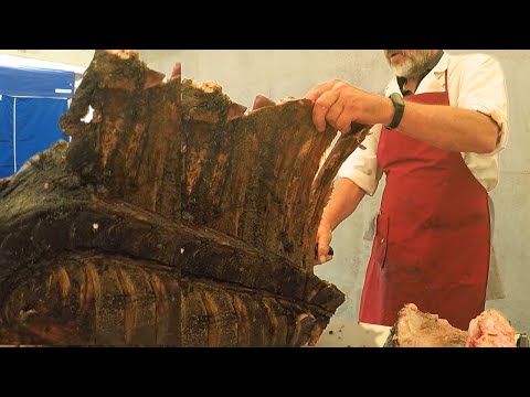 Gigantic Pieces of Bull Meat Roasted and Sliced  Italy Street Food Event