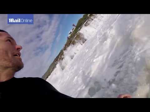 Surfers take on dangerous swells at Red Bull Cape Fear event