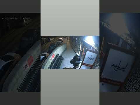 A guy stealing pair of shoes from a mosque