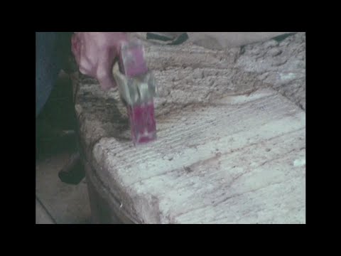 Millstone Dressing Worsbrough 1977 Old timer with shaky hands works stone to precision.