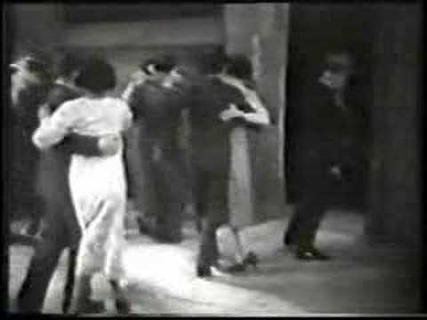  Carmencita Calderón  and  'El Cachafaz'  are  dancing  to  a  tango