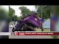 Dump truck gets tangled in wires