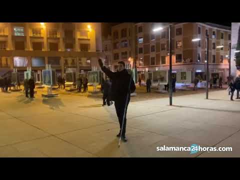 A young man sings "cara al sol" (Face to the Sun) at an anti-fascist demonstration.