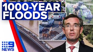 Stranded drivers rescued from bridge after one in 1000-year floods | 9 News Australia
