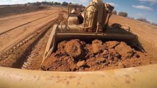 Operating Cat 627 Scraper from cut area to fill area