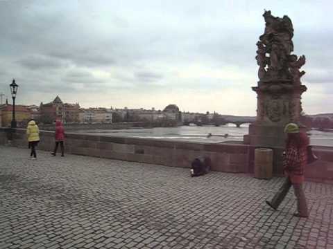 Susan and Bill on Charles Bridge rubbing St John statue