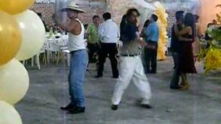 drunk men dancing at mexican party