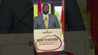 Republican rep. speaks about education in front of misspelled sign.
