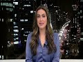 Woman TV News Presenter In Blue Satin Blouse