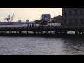 SMALL FLEET OF NEW YORK CITY TOUR HELICOPTERS TAKING OFF & LANDING ON A HELIPORT IN MANHATTAN, NYC.