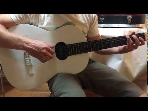 Vintage white classical guitar