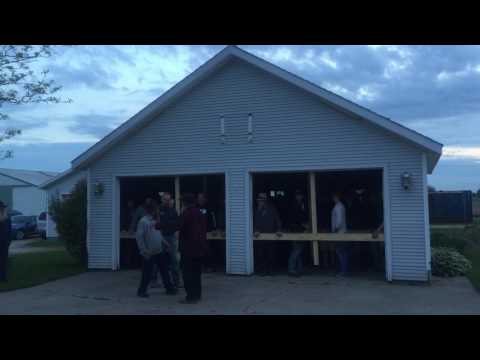 92 Amish Men Start Moving a Garage