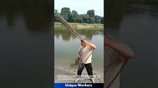 Traditional Fishing: Man Casting a Net in the River