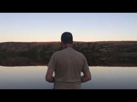 My husband flying his RC float plane on coffeepot lake; includes a pano of the campground area.