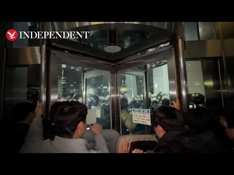 South Korean forces clash with crowds outside parliament after martial law declared