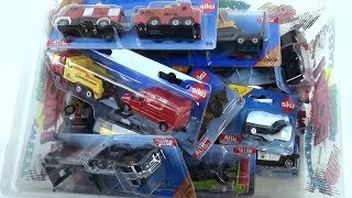Unpacking small siku cars from the  box