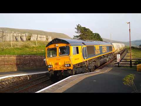 Dent St. on a warm late summer evening. GBRf 66704 passes with 6C00 17:15 Clitheroe-Carlisle N.Y