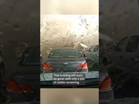 Jaw-dropping dash cam video shows tornado destroying building