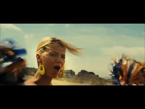 Official trailer frame: spring-break boats crowd Lake Victoria as bass-heavy party cues kick in