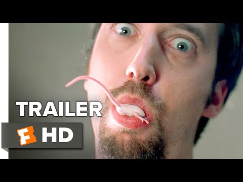 Trailer still: motel-lot shenanigans while a guitar riff slices in