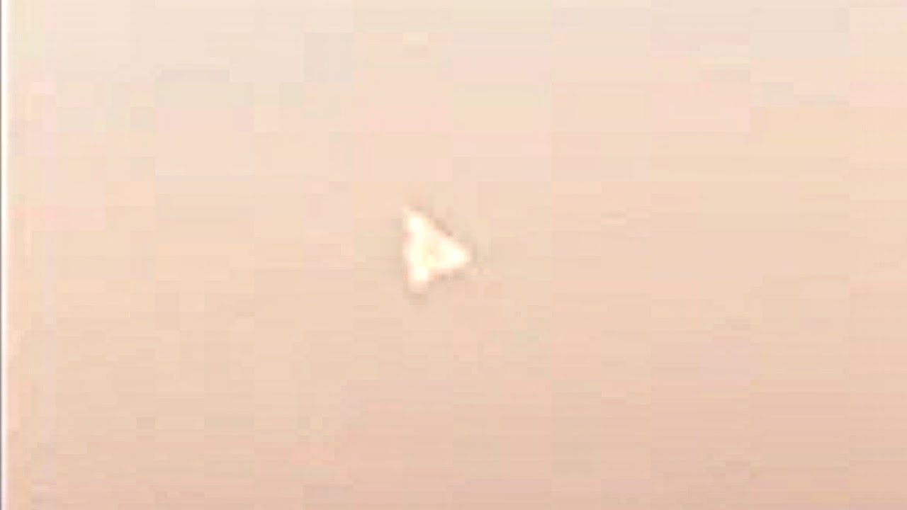 Luminous triangular UFO in the sky near Moscow.