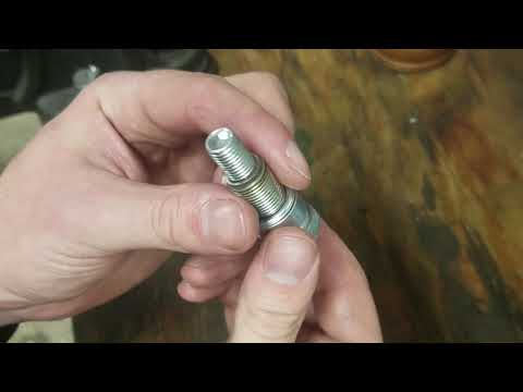 How to make a DIY piston stop tool from an old spark plug