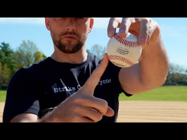 What is holding baseball?