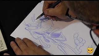 Cartoonist Oscar Martin drawing